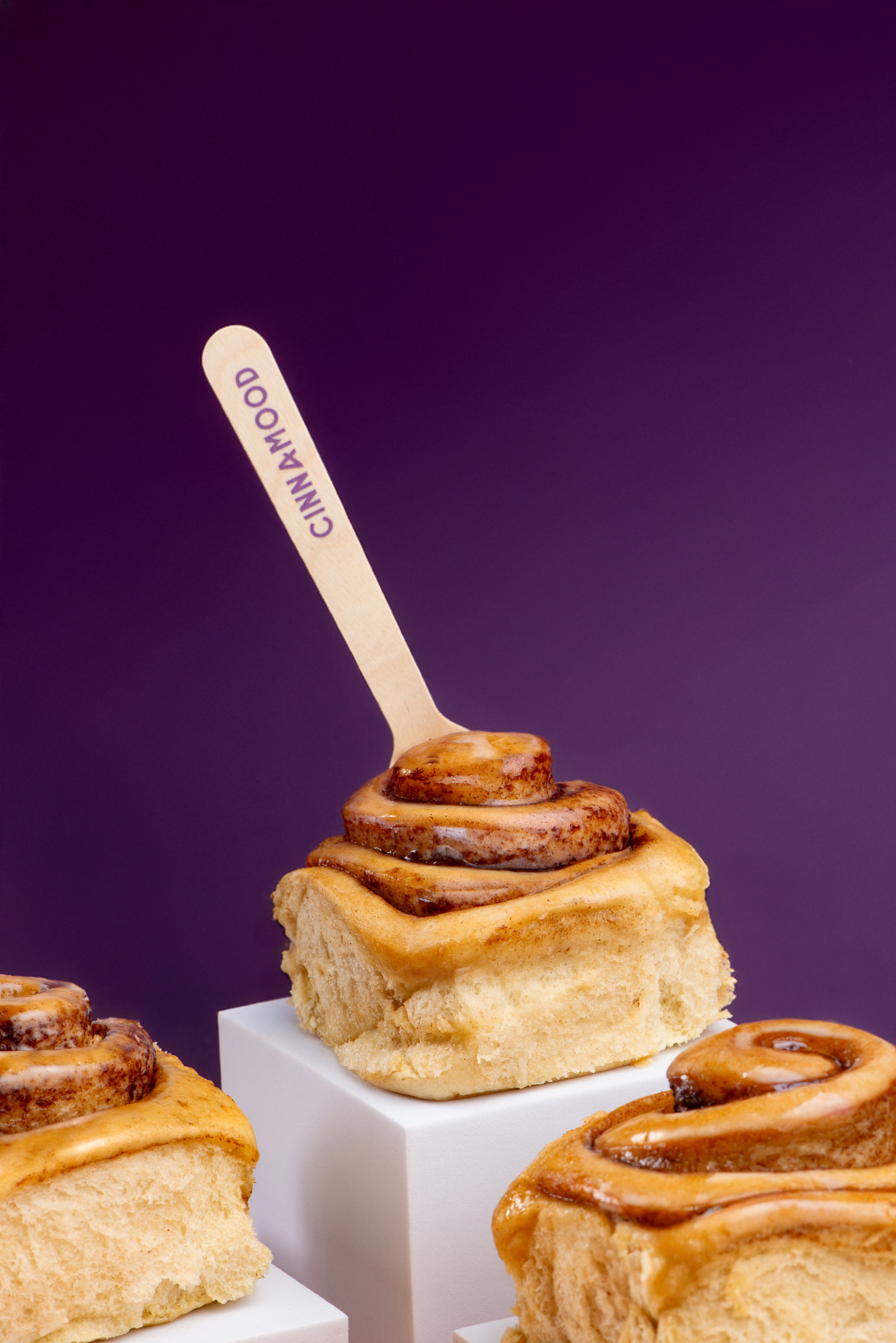 Cinnamood pastries on a studio backdrop